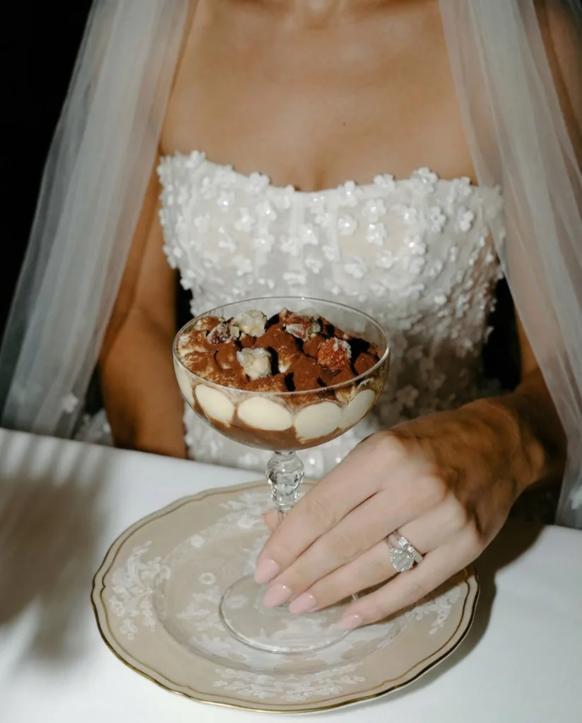 Bride in lace with dessert on a styled table